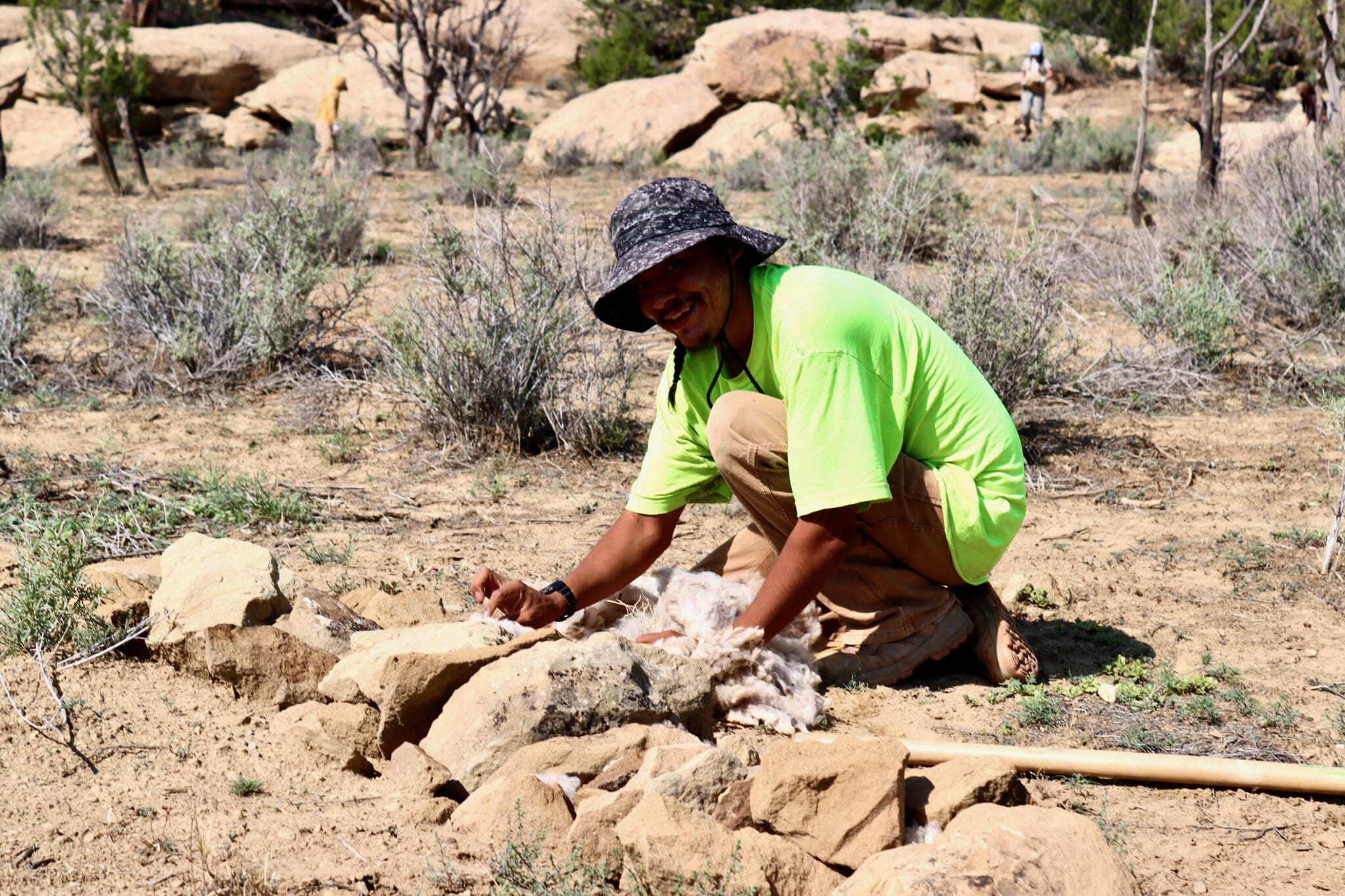 Rodney Yoe, Watershed Crew, installing a wool-imbued one-rock dam.